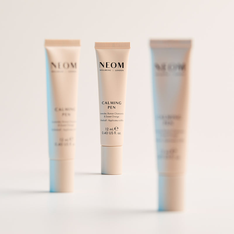 Three NEOM products on a light background