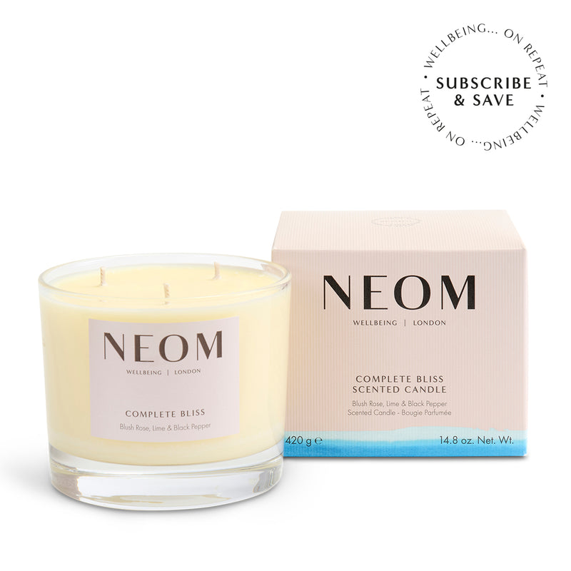 NEOM Complete Bliss scented candle with packaging on a white background
