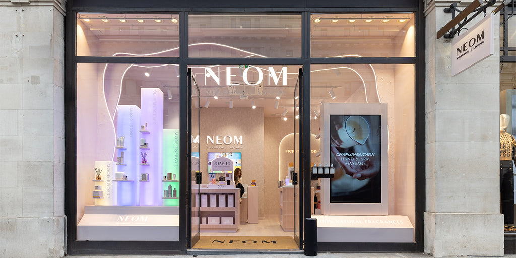 NEOM Regent Street store front with glass doors and illuminated interior