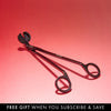 NEOM wick trimmer on a red background with promotional text at the bottom.