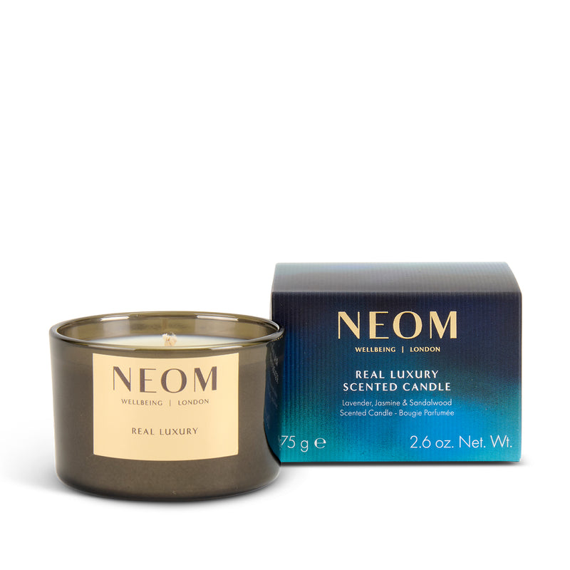 NEOM limited-edition Real Luxury scented candle with packaging on a white background