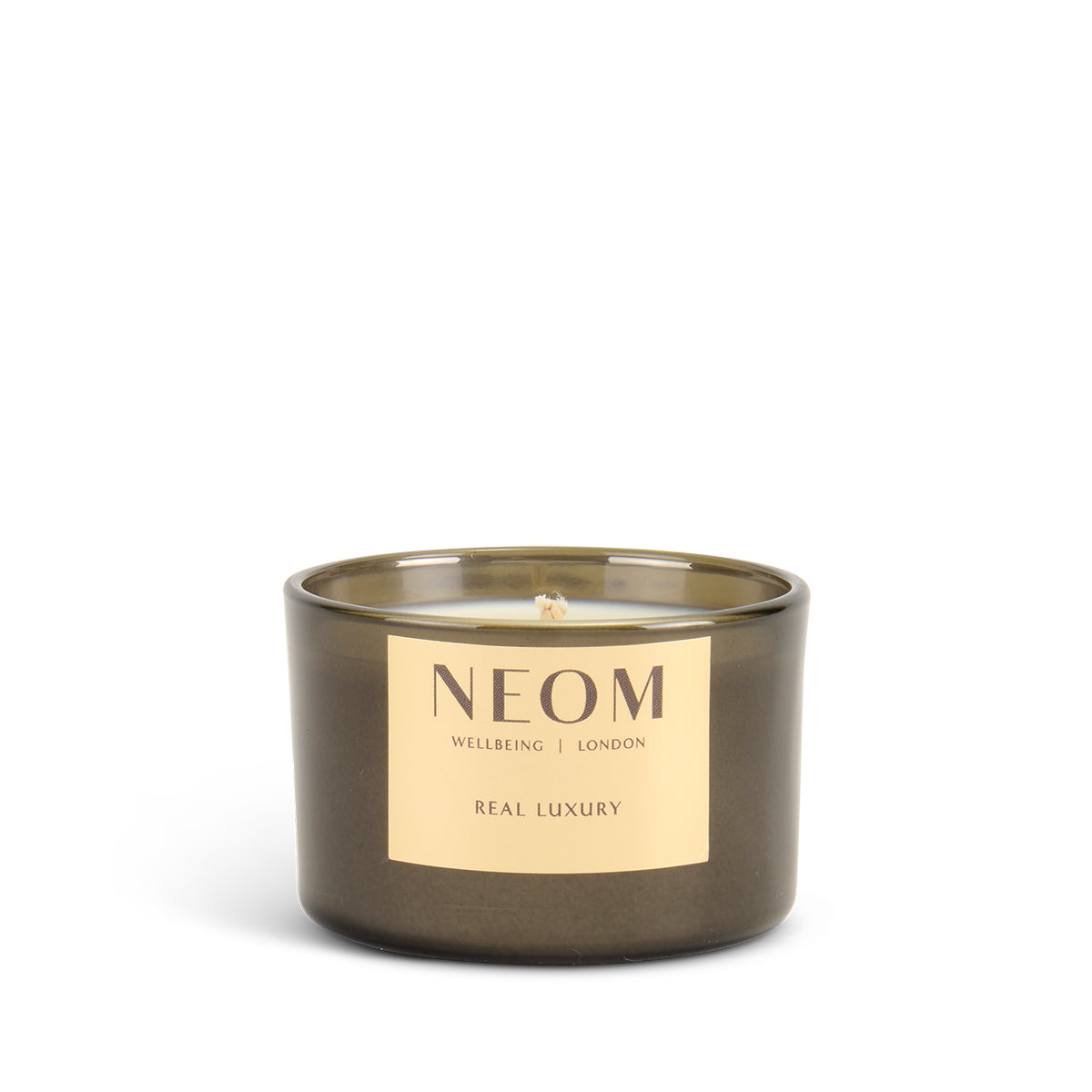 NEOM limited edition real luxury scented travel candle with a gold label on a white background