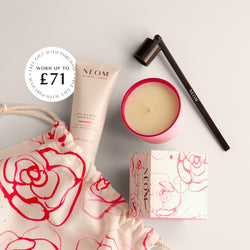 NEOM free gifts worth up to £71 featuring scented candle, It’s All Rosy hand balm, wick trimmer, and branded drawstring bag.