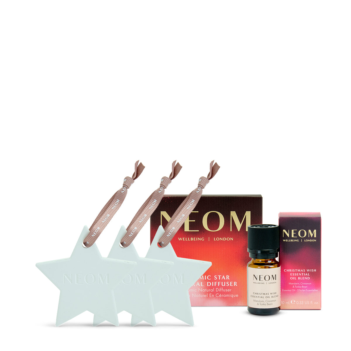 NEOM Christmas gift set with diffuser, oils, and packaging on a white background