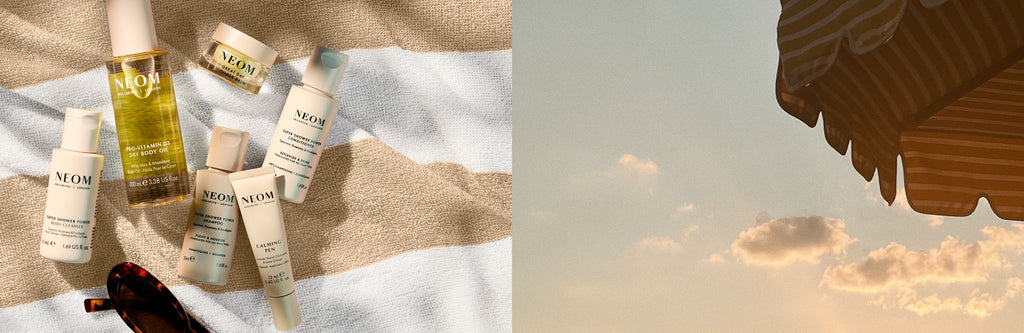 NEOM miniature skincare and body products on a textured surface with sunlight casting shadows
