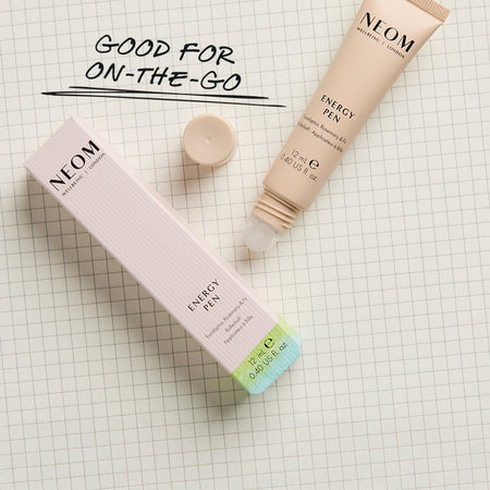 NEOM Energy Pen on a checkered background with text saying 'Good For On-The-Go'