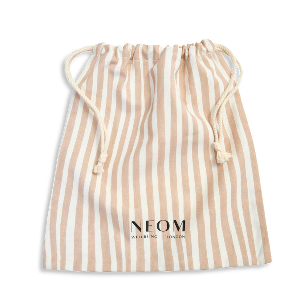Beige Large Drawstring Bag with 'NEOM' logo on the front