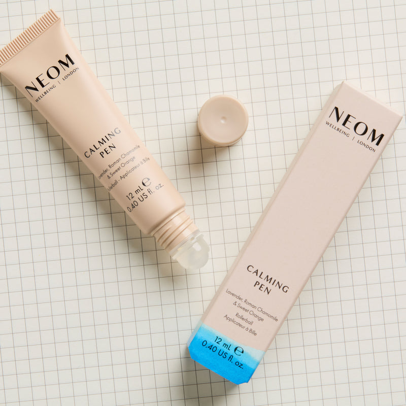 Neom Calming Pen on a grid background