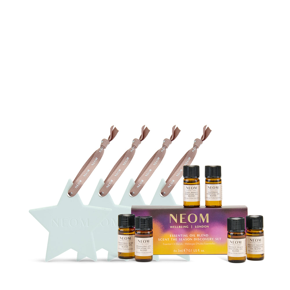 NEOM essential oil set with star-shaped holder on a white background