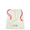 White drawstring bag with red strings and 'NEOM' branding on a white background