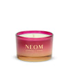 NEOM Christmas Wish Travel Scented Candle with pink and gold design on a white background