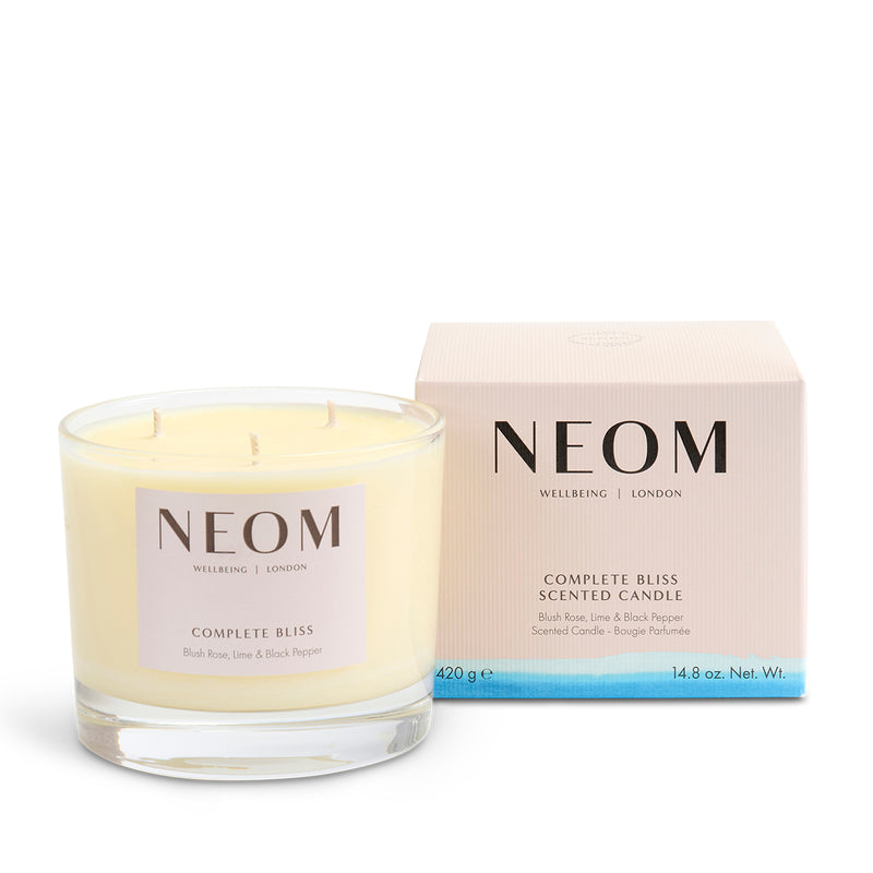 NEOM Complete Bliss scented candle with packaging on a white background