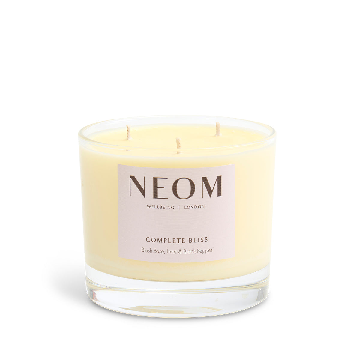 NEOM candle with a white background