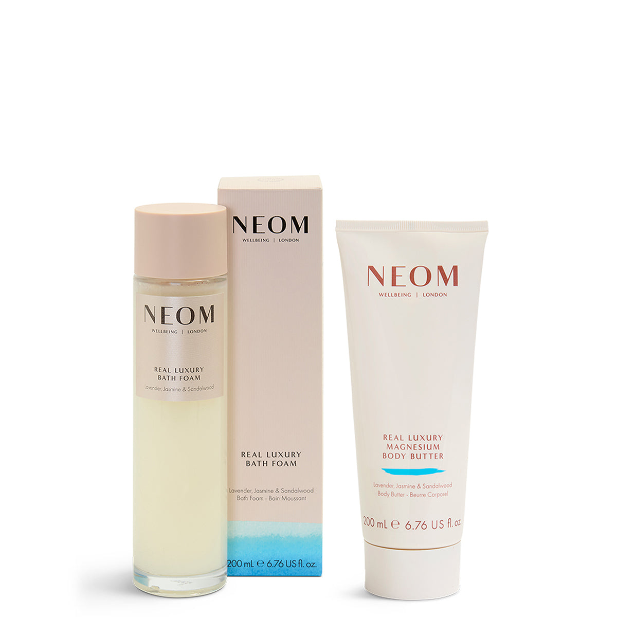 NEOM skincare products including a bottle, box, and tube on a white background