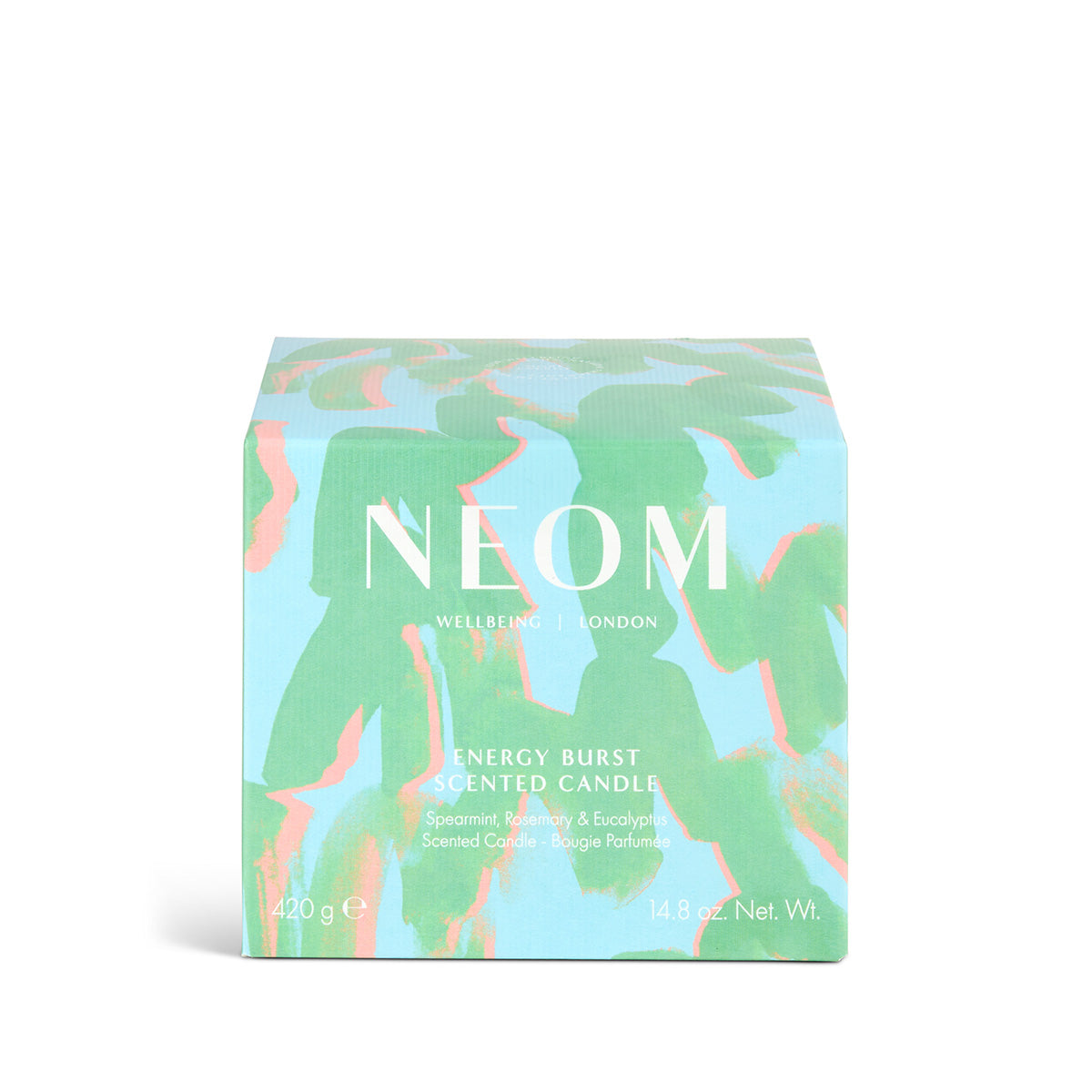 NEOM candle packaging with colourful green and blue design on a white background
