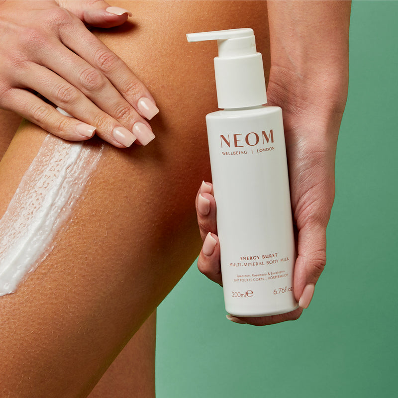 Energy Burst Multi-Mineral Body Milk being applied on a persons leg
