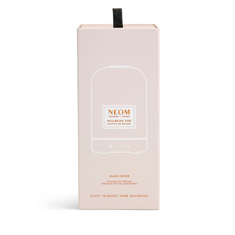 NEOM  glass cover pod essential oil diffuser box on a white background