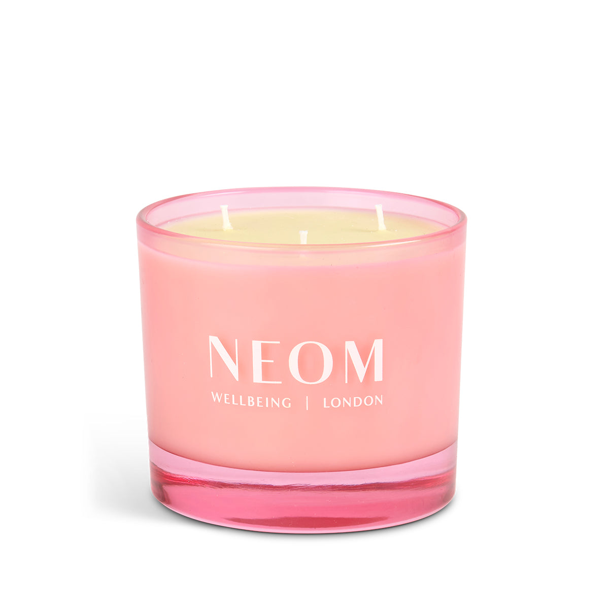 Pink NEOM candle on a white background