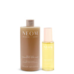 NEOM great day body wash and dry body oil on a white background