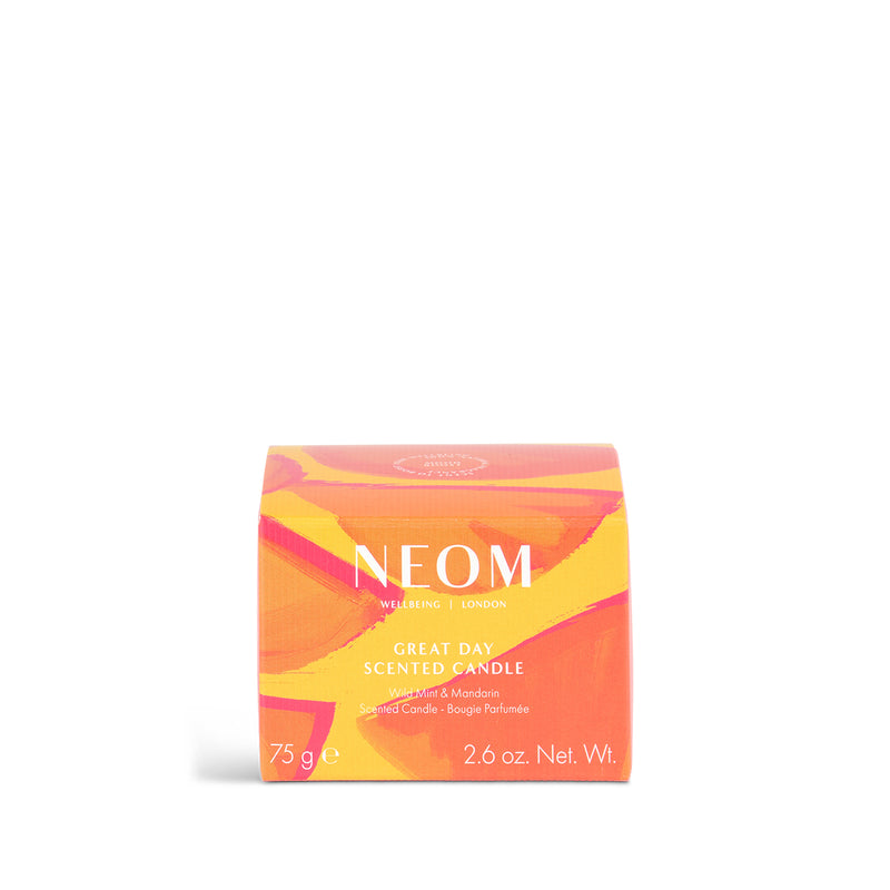 Neom candle packaging with colorful design on a white background