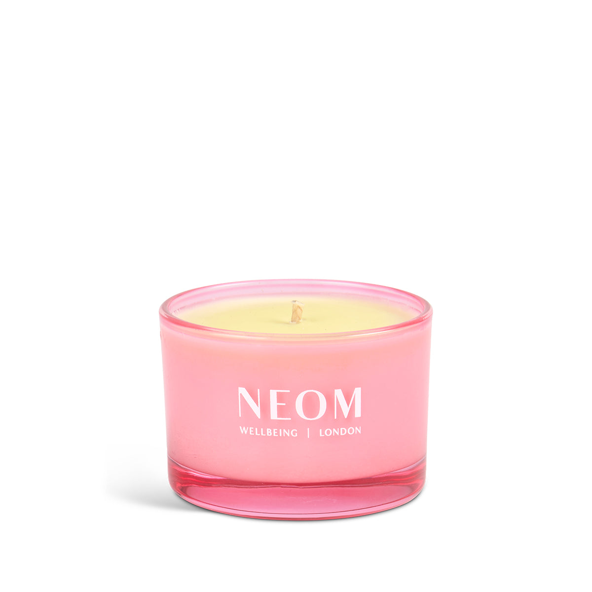 Pink NEOM candle on a white background
