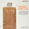 “NEOM Great Day Exfoliating Body Wash bottle with water splashes and foam. Text reads: ‘From meh to yes! 80% said the fragrance helped boost their mood by making them feel instantly uplifted*’. Small print: ‘*Independent blind study on 72 people, after initial use.’”