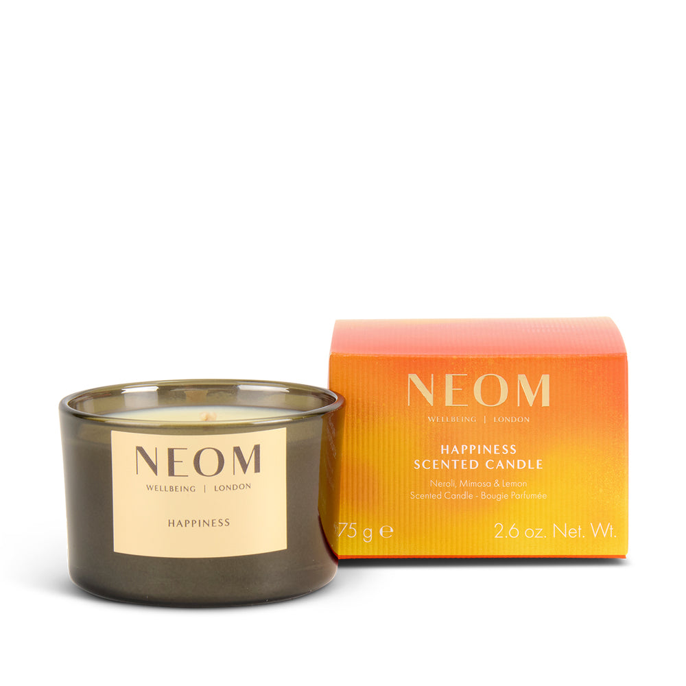 NEOM limited-edition happiness scented travel candle with packaging on a white background