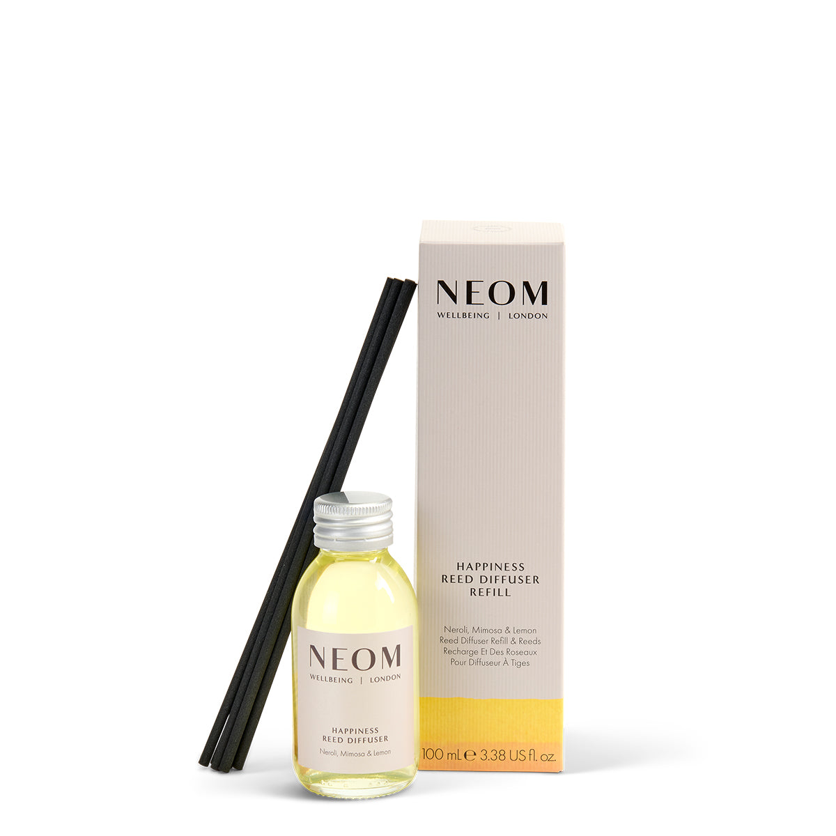 NEOM happiness reed diffuser set with bottle, sticks, and box on a white background