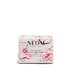 NEOM scented candle packaging with floral design on a white background