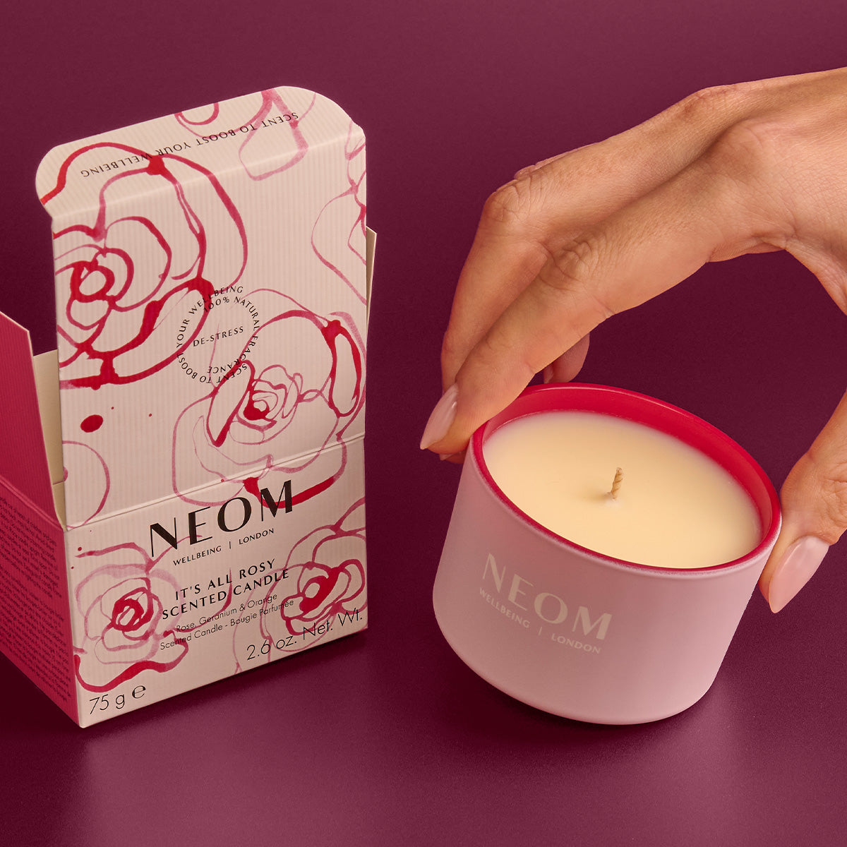 NEOM  candle and packaging on a purple background