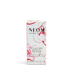 NEOM essential oil blend packaging with floral design on a white background
