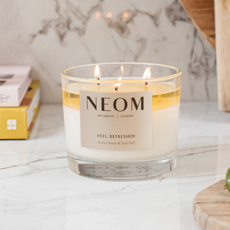 NEOM feel refreshed 1 wick candle on a marble tabletop