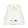 White drawstring bag with NEOM branding on a white background