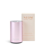 Pink NEOM diffuserwith packaging on a white background