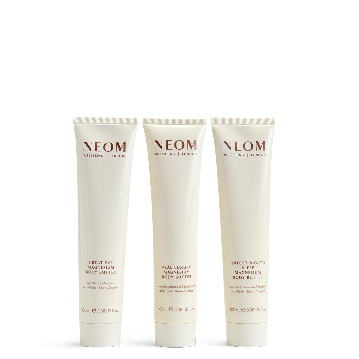 Three NEOM body butters on a white background