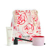 NEOM scented candle, It’s All Rosy hand balm, wick trimmer, and branded drawstring bag.