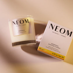 NEOM Happiness 1 Wick Scented Candle on a light background