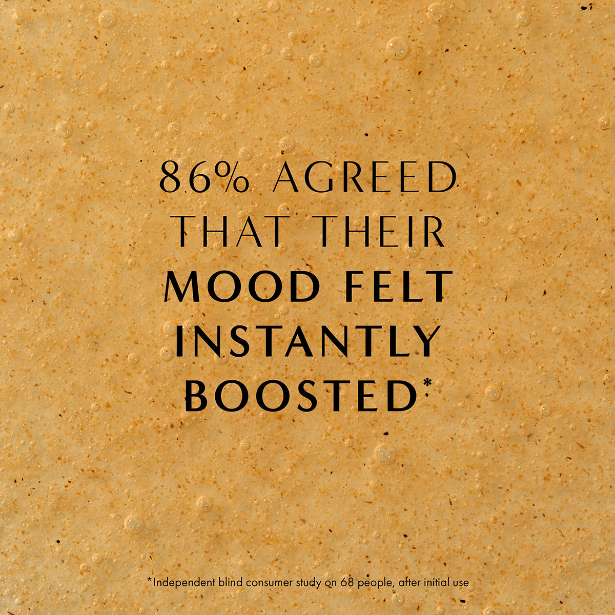 Close-up of natural exfoliating hand wash texture with bubbles and botanical particles