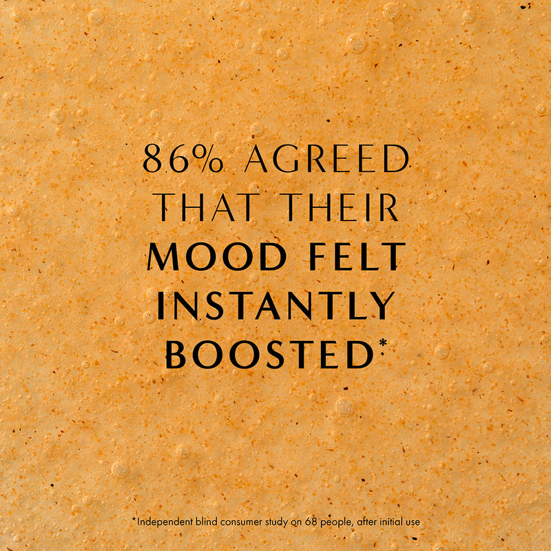 Close-up of natural exfoliating hand wash texture with bubbles and botanical particles