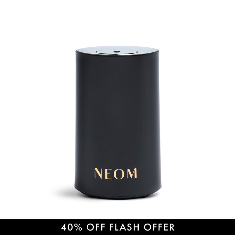 Black NEOM Pod Mini Diffuser on a white background with a discount banner at the bottom.