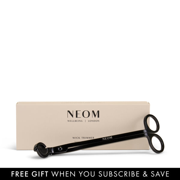 NEOM wick trimmer with packaging on a white background
