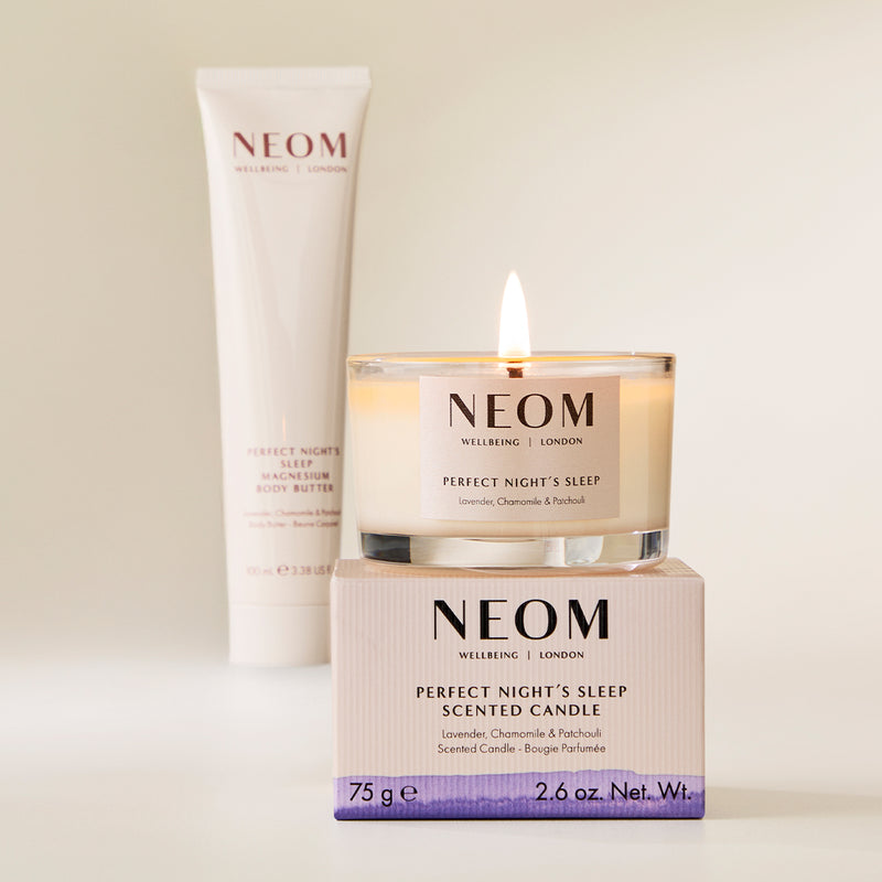 NEOM candle and body butter on a light background