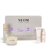 NEOM sleep wellbeing collection with various products on a white background