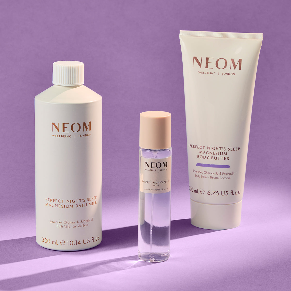NEOM bath & body products on a purple background