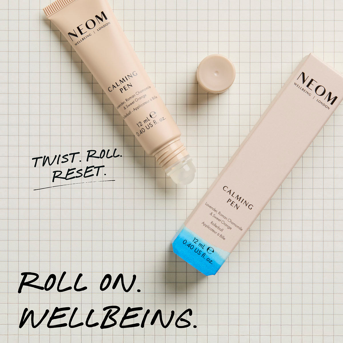 NEOM calming pen roll-on essential oil with packaging on neutral grid background for on-the-go relaxation