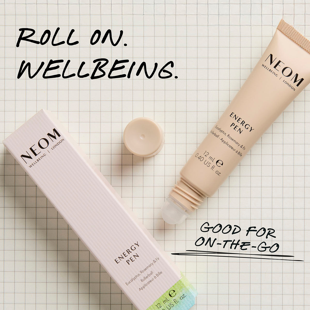 NEOM energy pen roll-on essential oil with packaging and “roll on wellbeing” message for daily use