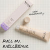 Person applying NEOM sleep pen roll-on to pulse point for bedtime relaxation and improved sleep routine