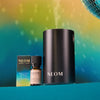 NEOM products including a diffuser, essential oil blend, and bottle on a gradient background