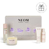 NEOM wellbeing collection with various products on a white background with a Perfect Gift roundel with a present