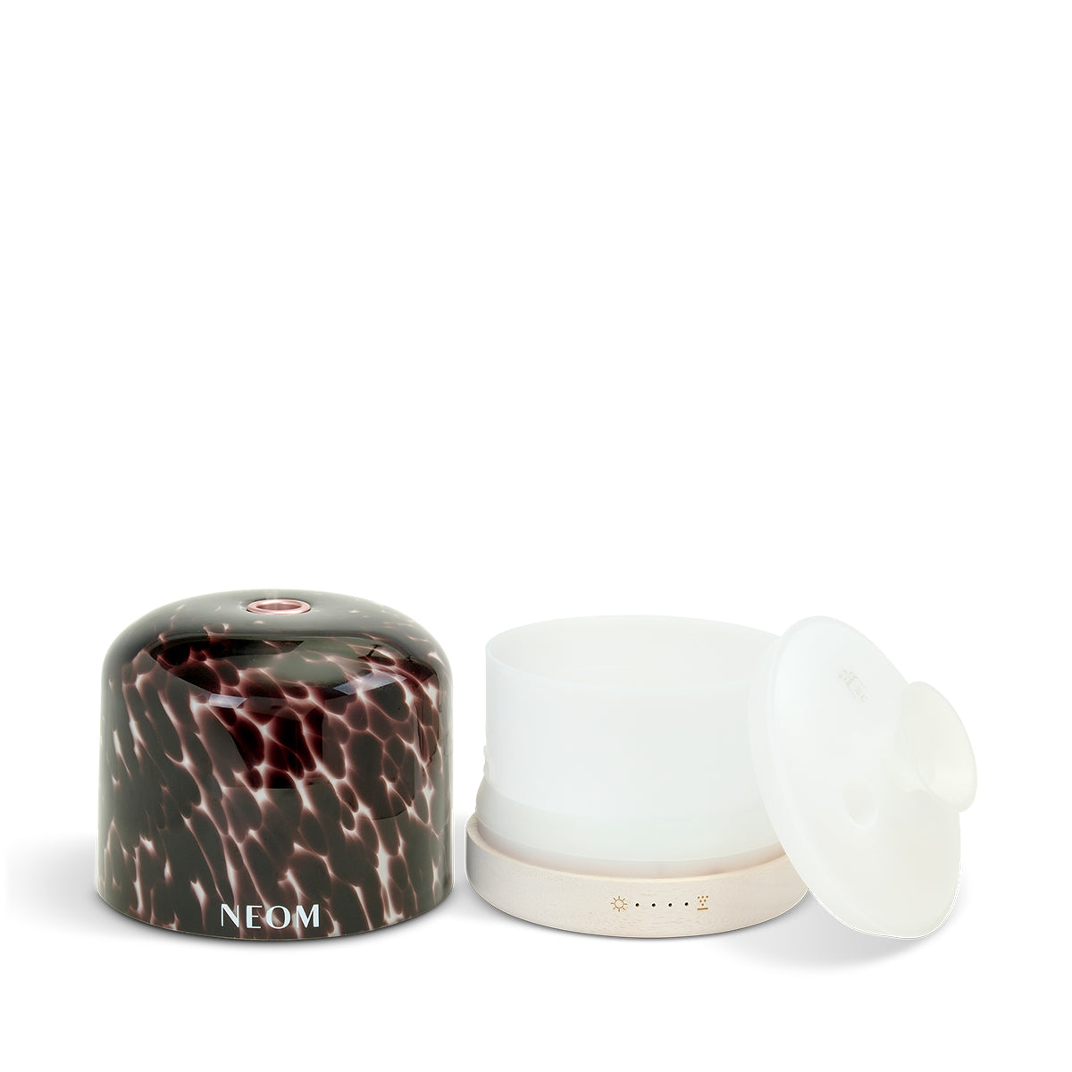 Tortoiseshell marbled design and 'NEOM' branding on a white background